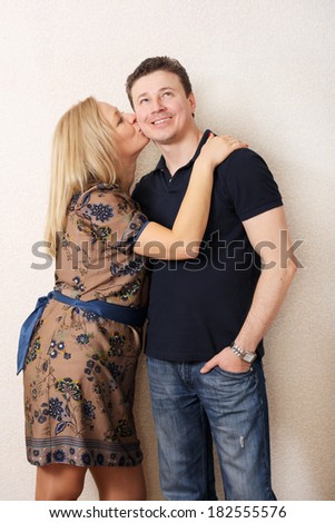 two happy couple woman kissing man. wife and husband strong love long time. studio