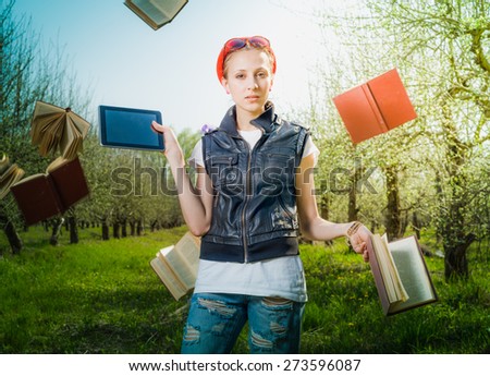 Woman making decigion choose book or tablet. Books flying on background.