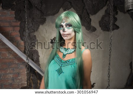 Young woman with sugar skull makeup