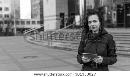 Black and White. BW. Young woman with Tablet reading from ebook