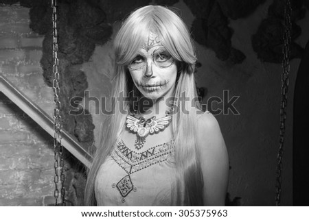 Black and white. Young woman with sugar skull makeup