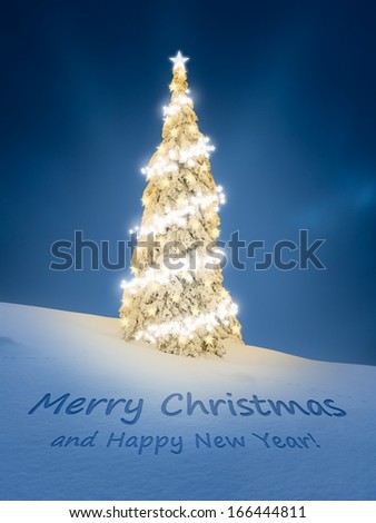 Merry Christmas card with text written in snow and golden glowing snow-covered tree in background