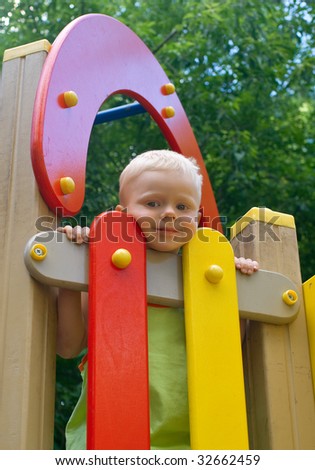 The little boy on a playground. Summer, outdoor