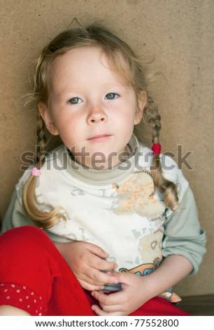 The little serenity girl on abstract background. Shallow DOF