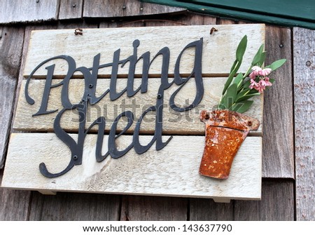 Colorful weathered wood sign at the local gardening shop