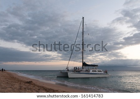 Catamaran cruise boat at sunset on Maui, Hawaii, USA