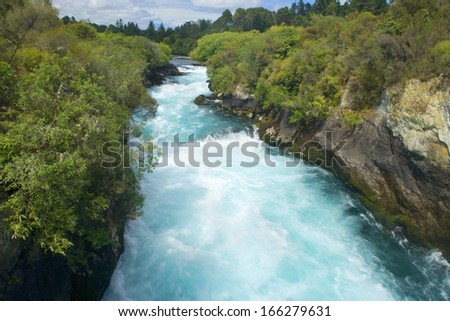 Wildwater river, water masses of Waikato river rushing down a gorge towards Huka Falls Taupo, North Island, New Zealand