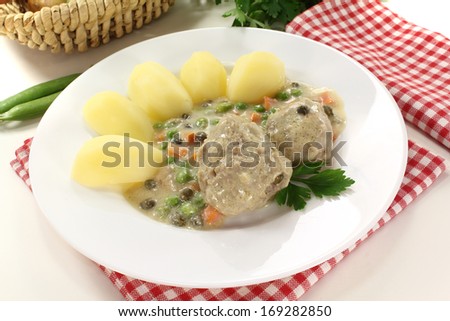 delicious cooked meatballs in a white sauce