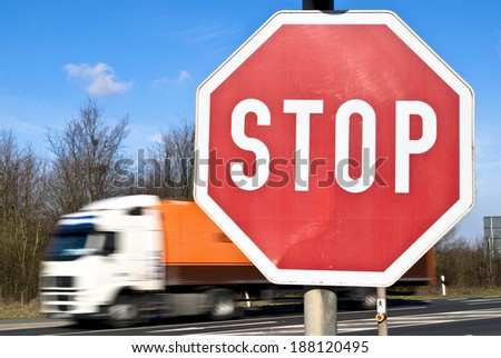 a truck and a stop sign