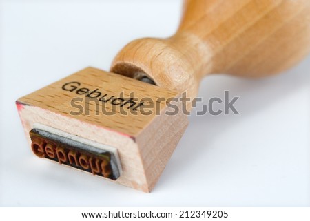 wooden stamp with the German word \