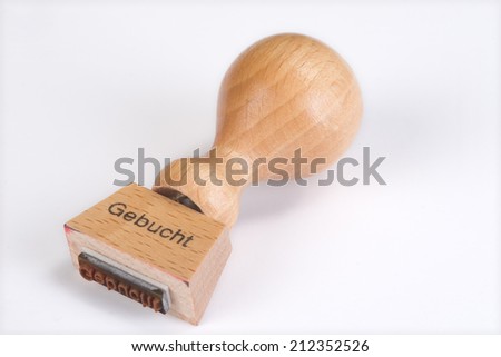 wooden stamp with the German word \