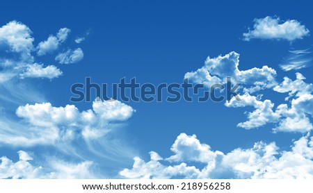 White cumulus clouds and a blue sky