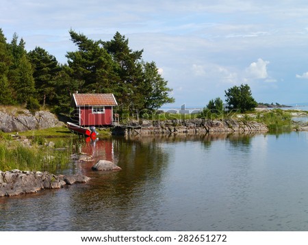 wooden hut at lake vÃ¤nern, sweden