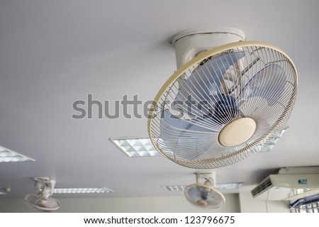 electric fan on white ceiling