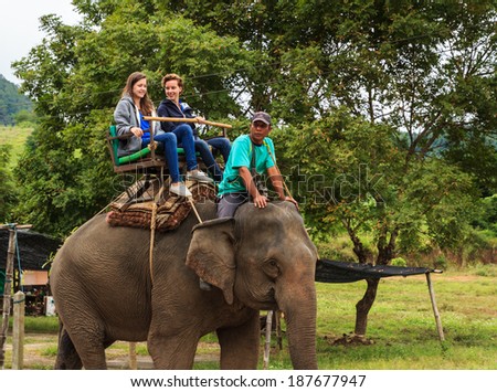 Chiangrai Thailand-November 15: tourist come visit and ride elephant sightseeing around Karen Elephant hill tribe village on November 15,2013 in,Chiangrai,Thailand. The amazing trip in Chiangrai