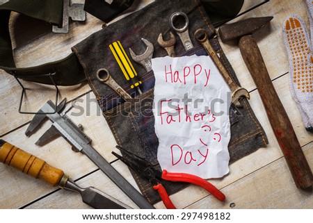 father day paper card with tool  from kid on wood