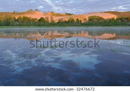 Landscape of sand dunes and reflections in calm water, Sleeping Bear Dunes National Lakeshore, Michigan, USA