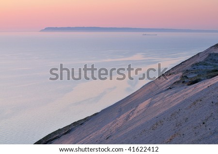 Landscape at twilight of sand dune, freighter, and waters of Lake Michigan, Sleeping Bear Dunes National Lakeshore, Michigan, USA