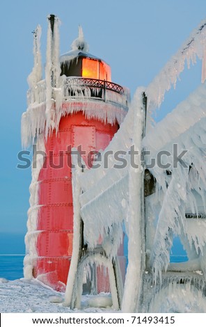 Winter, South Haven, Michigan Lighthouse glazed in ice, Lake Michigan, USA