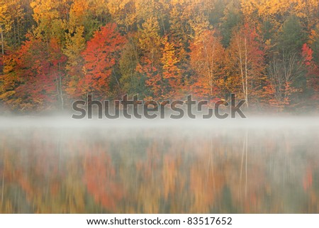 Autumn landscape at dawn of Moccasin Lake in fog, Michigan\'s Upper Peninsula, USA