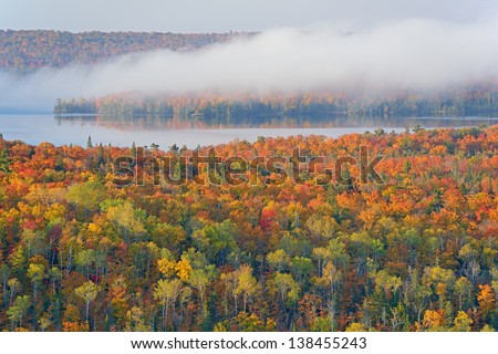 Autumn landscape of Lake Medora and forest in fog, Michigan\'s Upper Peninsula, USA