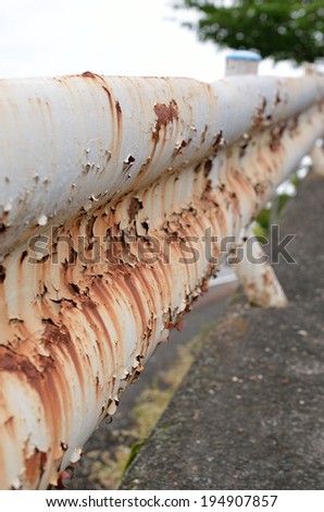 Rusted guard rail, Concept of ruin or oxidation