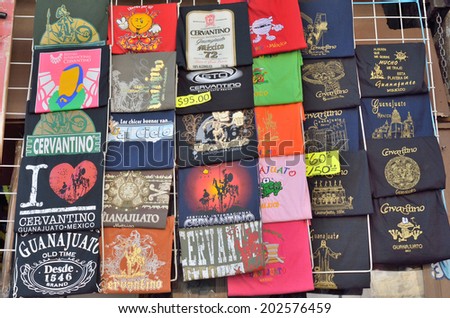 GUANAJUATO, MEXICO - NOVEMBER 9, 2013: T-shirts sold in the storefront of souvenir shop in the Historic mine city of Guanajuato.