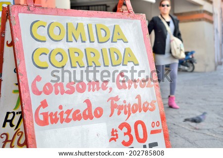GUANAJUATO, MEXICO - NOVEMBER 9, 2013: Signboard of lunch plate menu photographed in the UNESCO World Heritage city of Guanajuato.