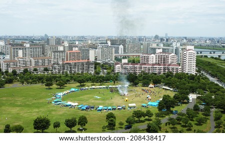 EDOGAWA, TOKYO - JULY 6, 2014: Disaster countermeasure training with real fire and smoke in Edogawa ward, downtown Tokyo. This event is held every year in July.