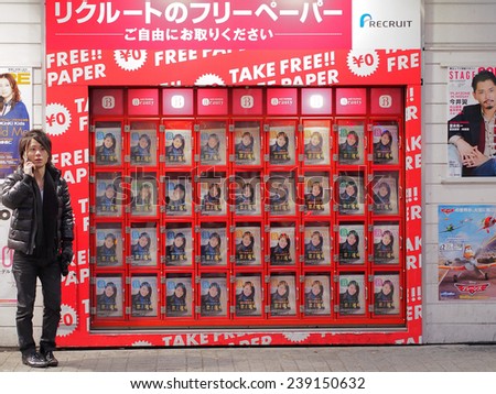 SHIBUYA, TOKYO - JANUARY 6, 2014: Free paper stand in the street of Shibuya. The paper is published and distributed by the company named Recruit, one of the biggest enterprises in Japan.
