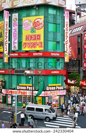 SHINJUKU, TOKYO - MAY 31, 2014: Commercial building of Pachinko gambling and Slot machine arcade in Shinjuku, the biggest business, shopping, restaurnts and night life district in Japan.