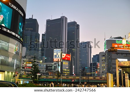 SHINJUKU, TOKYO - MAY 31, 2014: Illuminated commercial buildings, neon lights, billboards & restaurants in Shinjuku at night. One of the biggest & busiest commercial district in Japan.