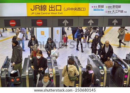 SHINJUKU, TOKYO - DECEMBER 20, 2014: Entrance gate with automatic ticketing machines in the Shinjuku station of East Japan Railway Company (JR)