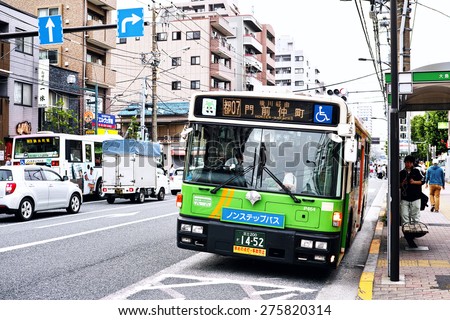 KOTO, TOKYO - JUNE 4, 2014: Commuter bus operated by the Bureau of Transportation of Tokyo Metropolitan Government. Its service extends all over the city of Tokyo.