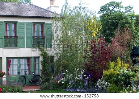 old french country house with old cycle in front