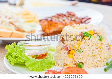 colorful fired rice on white plate