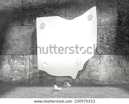 concrete blocks empty room with clear outline ohio state map attached to wall by bolts