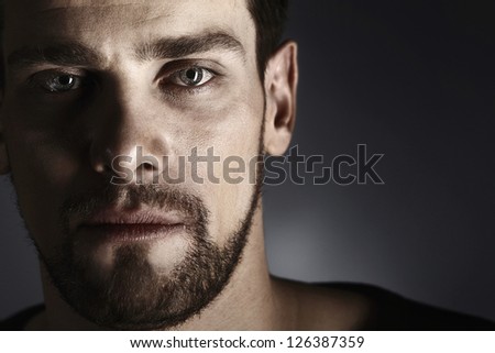 portrait of handsome young man with stubble