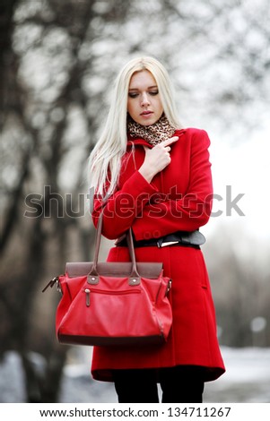 beautiful girl in a red coat