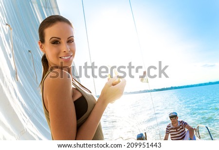 Beautiful woman on a yacht at summer.