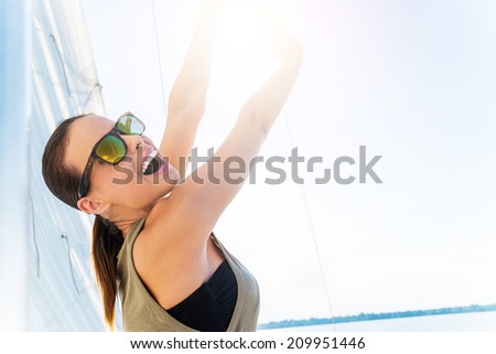Beautiful woman on a yacht at summer.