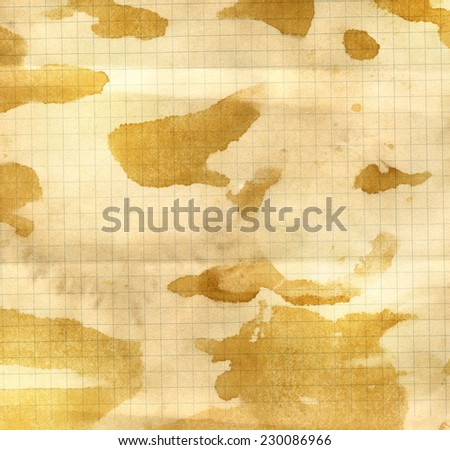 Paper background - coffee stains on sheet of graph paper