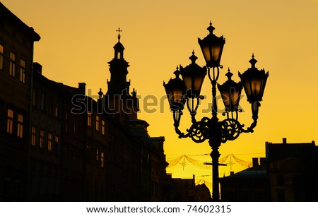 Sunset silhouette of old city lanterns in Lviv, Ukraine