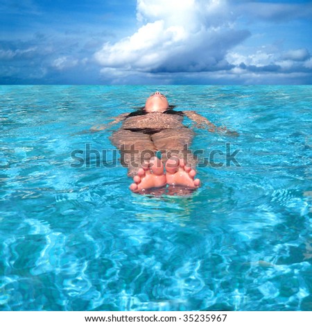 woman floating in the sea