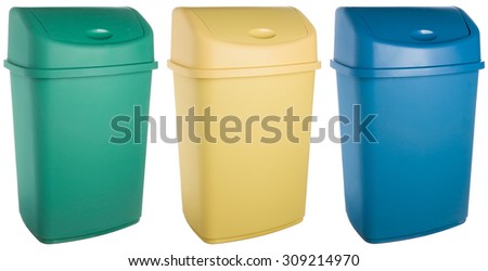Rectangular colored plastic selective trash cans, green for glass, yellow for metal and plastic, blue for paper
