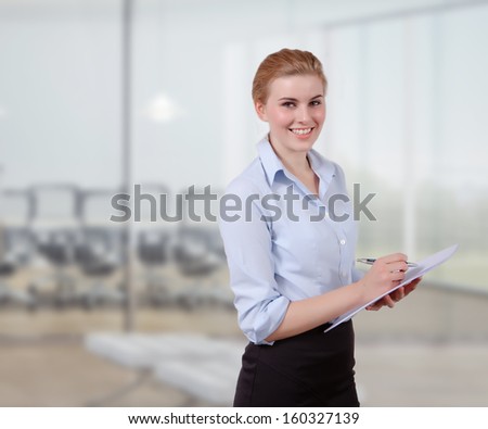 Businesswoman organizing her notes in office