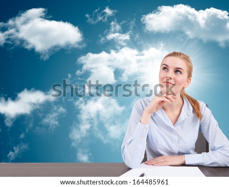 young businesswoman with head in the clouds