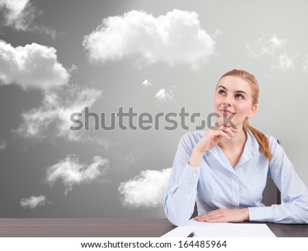 woman at desk think at new idea in the cloud sky