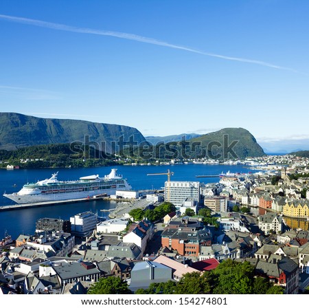 ALESUND, Norway: Cruise ship in Norwegian city Alesund - sea port in Norwegian fjords with Art Nouveau architecture.