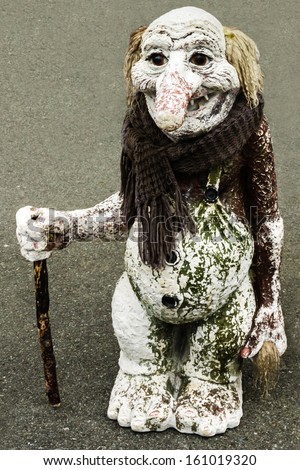 Troll figure isolated with scarf. Trolls are evil personages of popular Scandinavian folklore.